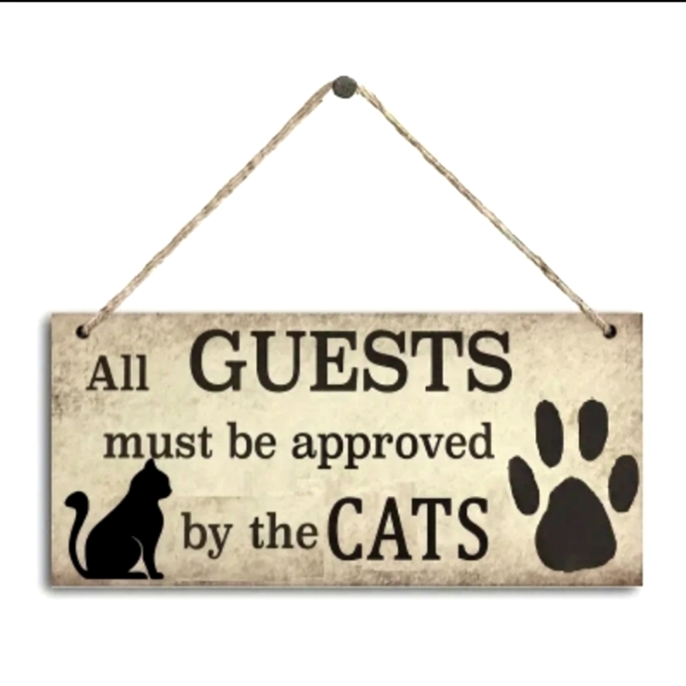 "All guests must be approved by the cats" wooden sign
